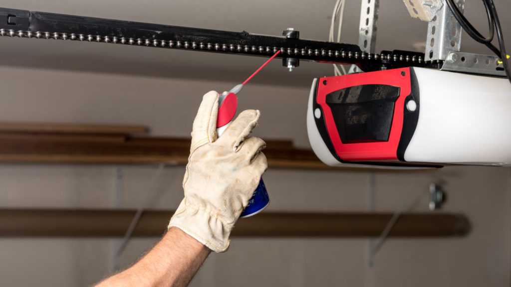 Technician servicing a garage door opener